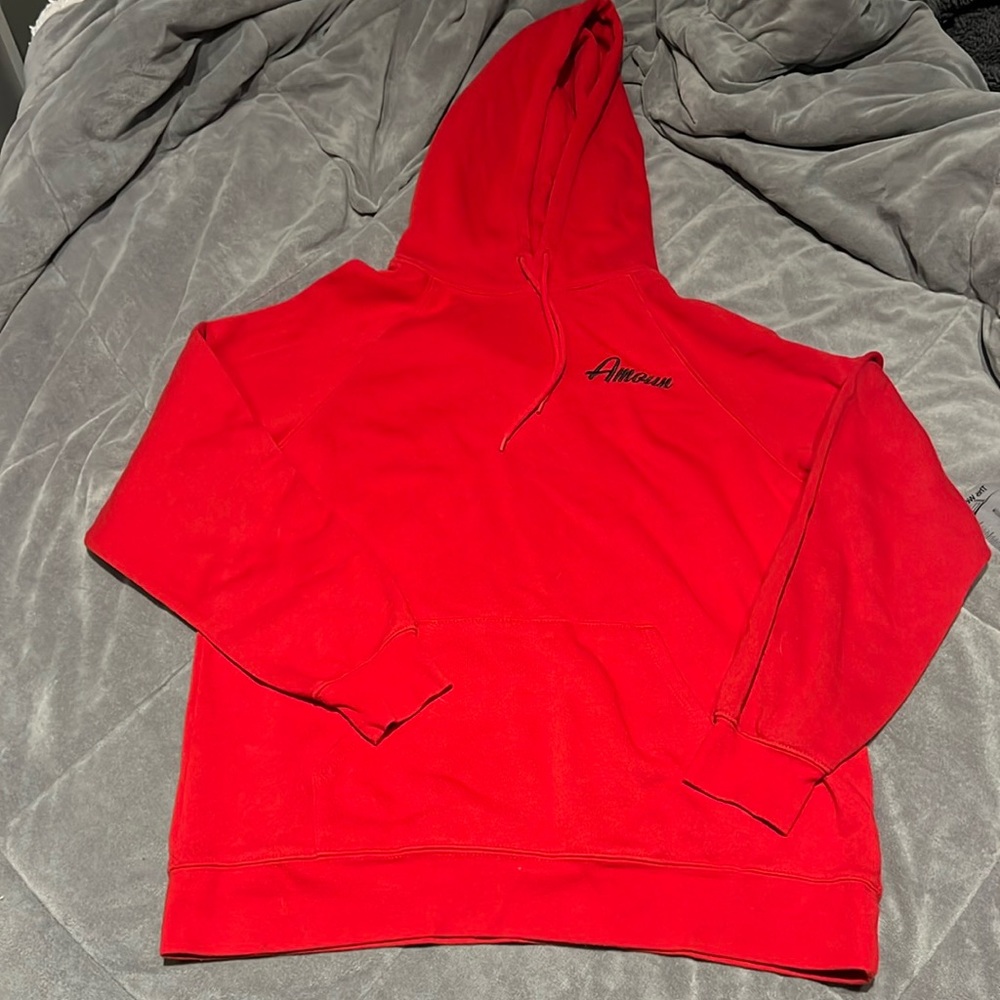 Red large sweater with “Amore” on it